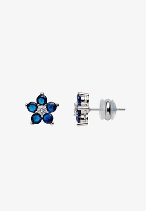 Orecchini a perno in argento con una gemma centrale trasparente circondata da sei pietre blu scuro a forma di goccia che formano un disegno floreale.