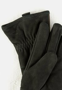 Gants en cuir noir avec une texture lisse, design de poignet froncé et coutures renforcées le long des seams, offrant un ajustement serré.