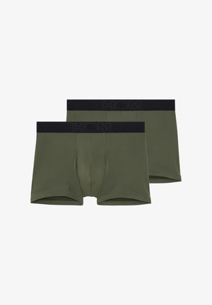 Groene katoenen boxershorts met zwarte elastische tailleband waarop de merknaam "HOM" is geperst. Zachte textuur, aansluitend ontwerp en lengte tot halverwege de dij.
