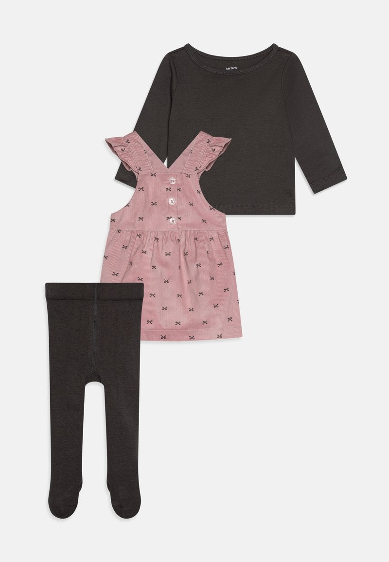 Two-piece outfit featuring a dark long-sleeve top, pink corduroy dress with ruffled straps and bow patterns, and black legging tights.