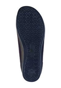 Shoe sole with a textured black rubber base, featuring a zigzag pattern and a circular logo at the heel. Side edges are dark brown.