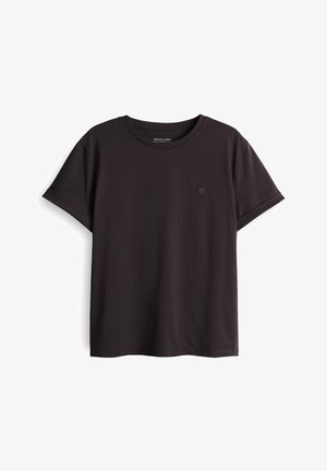Schwarzes T-Shirt mit kurzen Ärmeln aus Baumwolle, mit rundem Halsausschnitt und kleinem Herz-Logo auf der linken Brustseite. Glatte Textur.