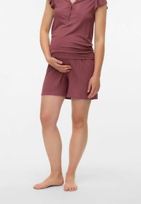 Mammaledighet loungedräkt i mauve, med ribbad textur, korta ärmar och elastisk midja på shortsen. Kort längd design.