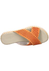 Orange cross-strap sandal with a textured upper, cushioned footbed, and rubber sole. Features perforations for breathability with branded detailing.
