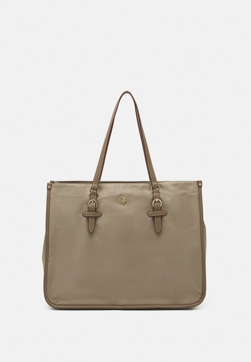 Sac cabas rectangulaire beige avec double anse d'épaule et petit emblème en forme de lion doré au centre devant.
