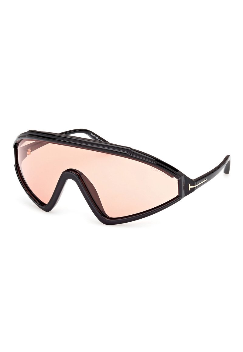 Mustat ylisuurommat aurinkolasit, joissa on geometrinen kehys ja vaaleanpunaiset linssit. Kehyksessä on teksturoitu muotoilu ja erottuva T-muotoinen yksityiskohta.