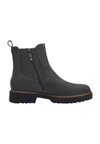 Bottine noire en cuir avec fermeture éclair latérale, languette à l'arrière, coutures marron et semelle épaisse à crampons pour une bonne adhérence.