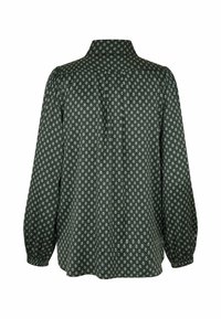 Blouse vert foncé à manches longues avec petit motif blanc en forme de losange, col montant et poignets froncés, vue de dos sur fond blanc.