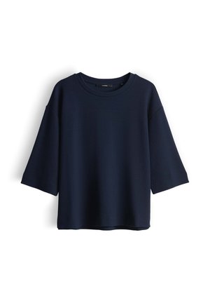 T-shirt bleu marine oversize avec un col rond et des manches trois-quarts, en tissu lisse, doté d'une coupe décontractée.
