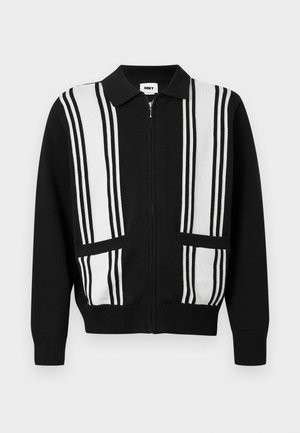 Črni kardigan z zadrgo, bele navpične črte in dvema sprednjima žepoma, z ovratnikom ter rebrastimi manšetami in robom.