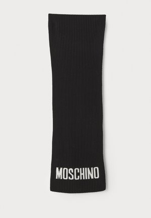 Mustmustri ribane sokid otse kujuga. Allosas on valge "MOSCHINO" tekst. Siledat tekstuuri, ühtlane värv ja struktureeritud disain.
