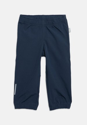 Βρεφικό παντελόνι σε ναυτικό μπλε με ελαστική ζώνη μέσης και αστραγάλους, με μια μικρή αντανακλαστική λωρίδα σε ένα πόδι.