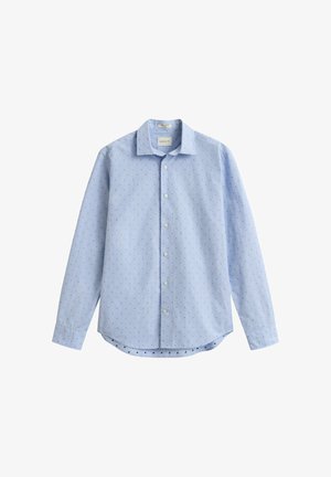 Camicia azzurro chiaro a maniche lunghe con bottoni, motivo a piccoli puntini scuri, collo classico e orlo arrotondato.