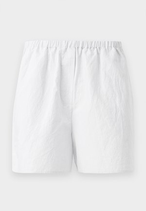 White shorts with an elastic waistband, featuring a textured fabric and a relaxed fit. Simple design, no patterns or embellishments.