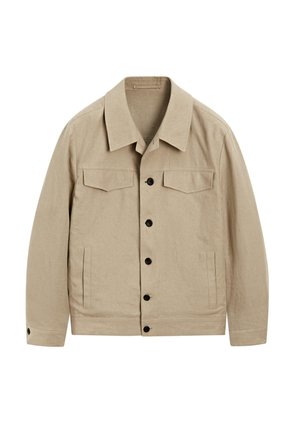 Beige jacket made of a textured fabric. Features a collar, two chest pockets, and black buttons down the front. Slightly relaxed fit.
