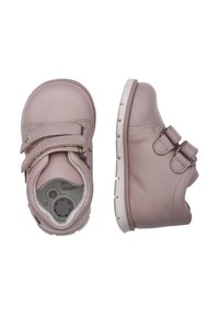 Scarpe in pelle rosa chiaro con chiusura a doppia fibbia e suola in gomma bianca. Design rotondo con dettagli cuciti e interno imbottito.