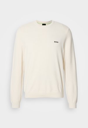 Kreemi värvi ringkaelusega sviiter, millel on pikad varrukad, soonikkoes mansetid ja "BOSS" logo vasakul rinnal.