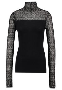 Svart långärmad topp med hög krage, med genomskinliga spetsärmar med intrikata mönster och dragkedja vid halsen.