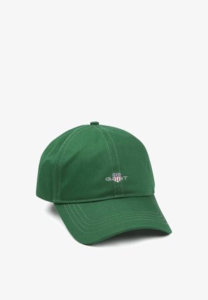 Green baseball cap made of cotton with a stitched logo on the front, featuring a curved visor and six-panel design.