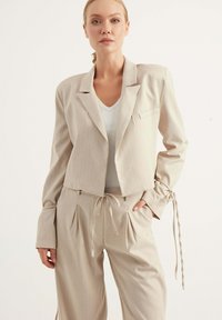 Chiquelle Tygbyxor - beige