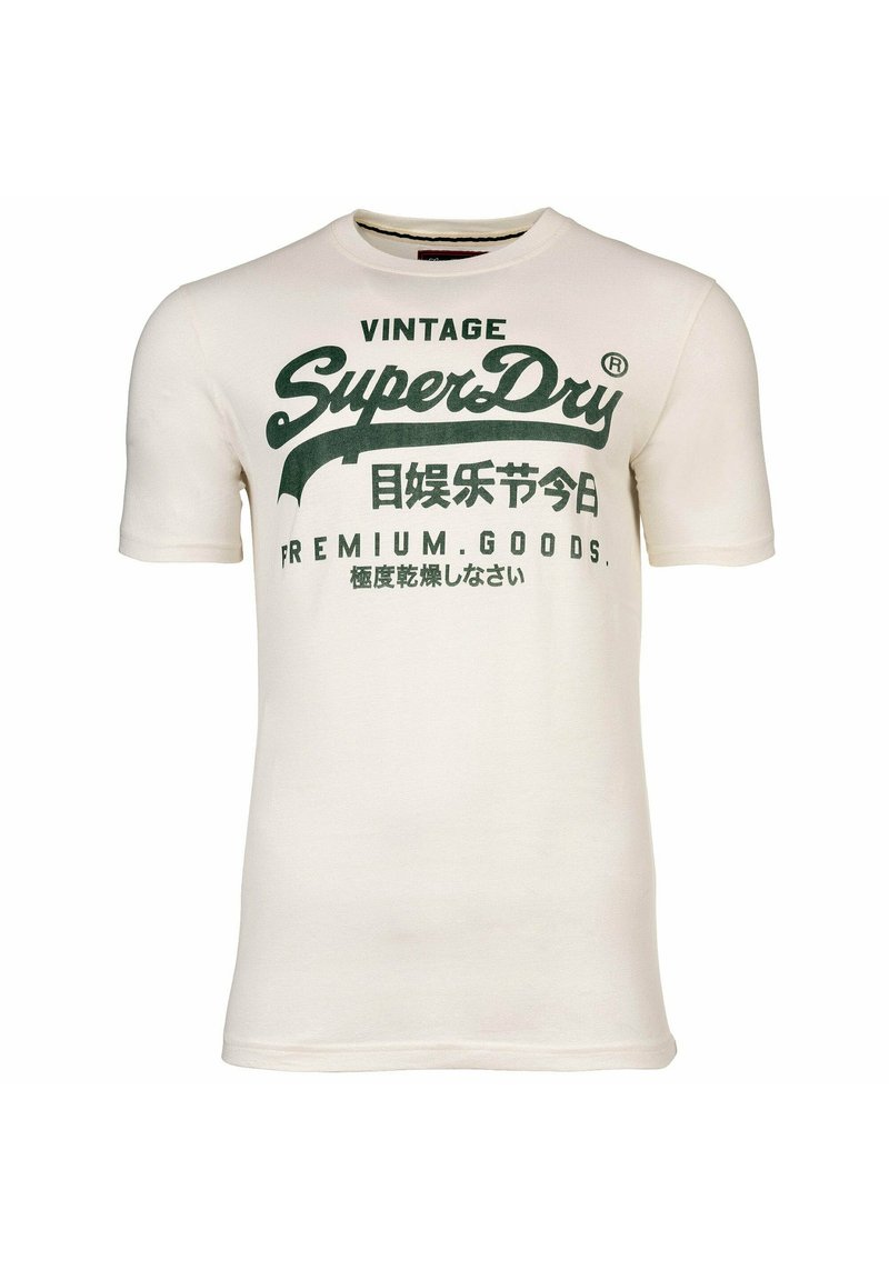 Camiseta de algodón de manga corta en color crema, con texto y logotipos impresos en verde, incluyendo "Vintage" y "SuperDry", con un detalle mínimo.