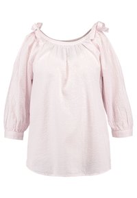 Vaaleanpunainen blusa, jossa on teksturoitu ilme, leveä pääntie, puffimaiset hihat ja solmimiset olkapäillä. Pehmeä kangas, jossa on rento malli.