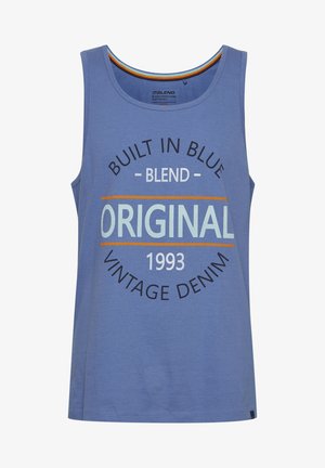 Sømløs blå tanktop laget av bomull, med sirkulær grafisk tekst: "Bygget i blått," "Original," og "Vintage denim 1993."