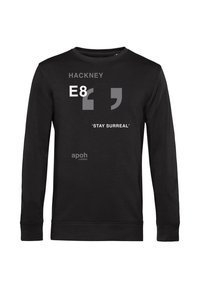 Felpa nera a maniche lunghe con testo bianco: "HACKNEY," "E8," e "'STAY SURREAL'" con virgolette e logo "apoh London". Texture liscia.