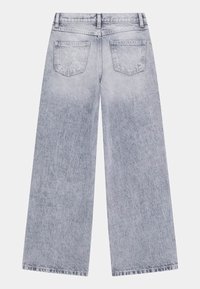 Light gray wide-leg jeans with a faded finish, featuring back pockets, one with a star design, and a subtle "QUEEN" embroidery.