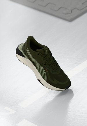 Olive green athletic shoe made of mesh and rubber, featuring a textured upper, white midsole, and subtle logo accents.