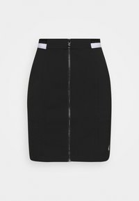 Svart mini kjol med framflicka silverdragkedja och vita midjeaccent som har delvis "Calvin Jeans"-text.