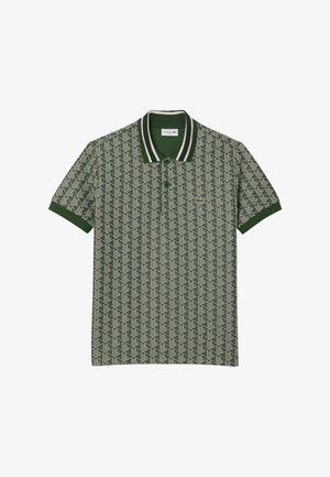 Groene polo met een geometrisch patroon, ribbelkraag met witte strepen en een klein logo op de borst. Gemaakt van een katoenmix.