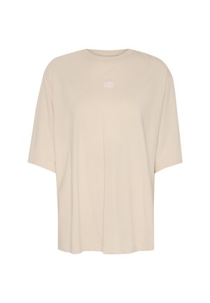 Oversized beige t-shirt made of soft cotton with a round neckline and short sleeves. Features a small white logo on the chest.