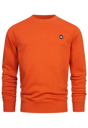 Oranžová mikina s okrúhlym výstrihom, rebrovanými manžetami a lemom. Na ľavej strane hrude má malé čierne logo. Vyrobená z mäkkého materiálu.