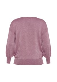 Helles rosa, glitzerndes, übergroßes Sweatshirt mit weitem Halsausschnitt, fallenden Schultern und langen Ärmeln. Weiche Textur mit geripptem Saum am unteren Ende.