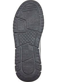 Svart gummisul med strukturerade vågmönster, rektangulära grepp och en segmenterad design för förbättrat grepp och hållbarhet.