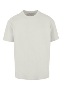 Lichtgrijze t-shirt met korte mouwen van katoen. Ronde halslijn met een losse pasvorm, geen zichtbare patronen of versieringen.