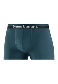 Teal boxershorts van zacht materiaal. Voorzien van een zwarte elastische tailleband met het "bruno banani" logo in het wit. Voorzakontwerp.