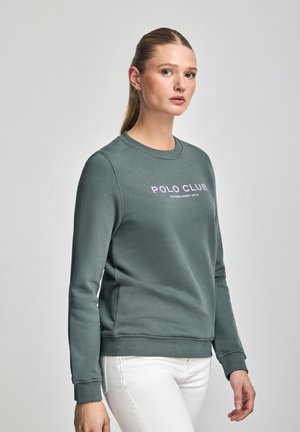 Zielona bawełniana bluza z okrągłym dekoltem, długimi rękawami i różowym logo z przodu. Teksturowana tkanina z prążkowanymi ściągaczami i dolnym brzegiem.