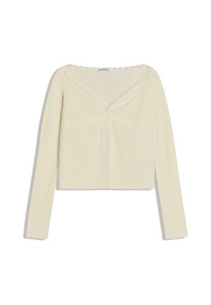 Maglia a maniche lunghe color crema in maglia costina con bordi smerlati e rifinitura in pizzo, caratterizzata da una silhouette aderente e una scollatura a V.