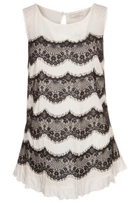 Mouwloos topje van witte stof met een gestructureerde afwerking, voorzien van zwarte kantdetails in golvende patronen en een gerimpelde zoom. Sleutelgatrug.