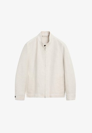 Veste beige clair à fermeture éclair avec col montant, deux poches avant et détails de boutons sur le col et les poignets, présentée sur un fond blanc.