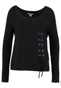 Musta neulottu villapaita, jossa on pyöreä pääntie, pitkät hihat ja nauhakiinnitys vasemmalla puolella, jossa on silmukat ja solmut. Pehmeä tuntuma.