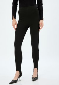 STIRRUP - Leggingsit - black