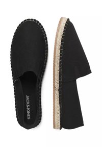 Black slip-on shoes with a textured fabric upper and a jute-trimmed sole. Features elastic side panels and stitched detailing along the edges.