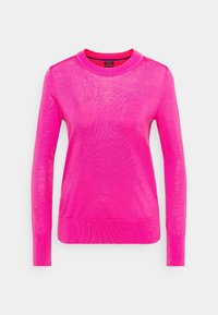 Pull à manches longues de couleur rose vif, fabriqué en maille légère. Présente un col rond ainsi que des poignets et un ourlet côtelés.