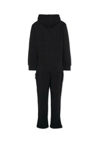 Zwarte katoen hoodie met een capuchon en bijpassende joggingsbroek. Eenvoudig ontwerp, zachte textuur en ontspannen pasvorm. Broek heeft uitlopende zoom.