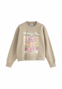Beige verkürzter Sweatshirt mit einem mehrfarbigen Grafik von Lippen in einem Gitter, mit dem Text "The Rolling Stones" und "Die größte Rock'n'Roll-Band der Welt" darunter gedruckt.