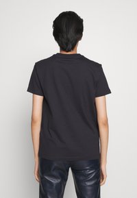 COACH Camiseta estampada - black