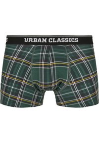 Grüne karierte Boxer-Shorts mit einem schwarzen elastischen Bund, der "URBAN CLASSICS" in weißem Text zeigt. Der Stoff hat eine weiche Textur und ein stabiles Muster.